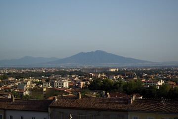 panorama of the royal palace of caserta with the Vesuvius volcano in the background
