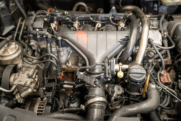 Fototapeta na wymiar Checking and repairing an internal combustion engine in an auto repair shop.