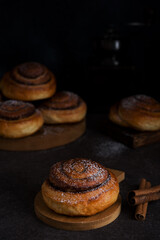 Homemade buns with cinnamon and powdered sugar, homemade pastries