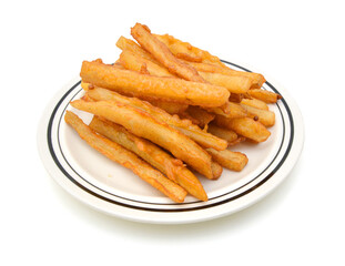 Homemade oil fried sweet potato fries on white background 