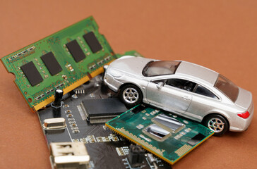 Fototapeta premium Electronic cars. There is a car on microcircuits, memory and electronic board.