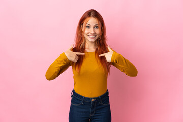 Teenager Russian girl isolated on pink background with surprise facial expression