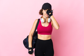 Young sport woman with sport bag over isolated background covering eyes by hands. Do not want to see something