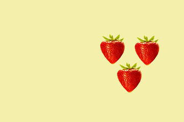 strawberries on a yellow background