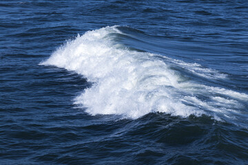 Stormy sea view, deep blue water surface with wave and foam