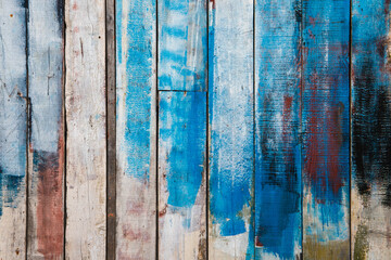 Grungy randomly painted old wooden wall