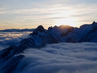 Spectacular view of Alpstein mountains at sunset in winter seen from the mountain station of Hoher Kasten cable car. Appenzell, Switzerland.