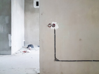 Wiring. Sockets and wires in the wall - room repair