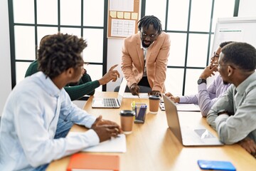 Group of young african american business workers smiling happy working at the office.