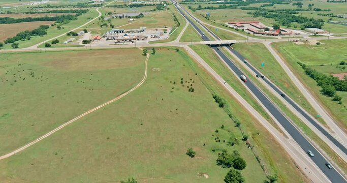 Panorama aerial view of highway 66 road of transport junction from the height near Clinton small town in Oklahoma USA a sunny day