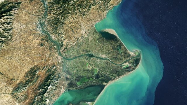 Time lapse of land changing in Ebro river delta, aerial satellite view from space of Spain coast Mediterranean sea. Based on image furnished by Nasa