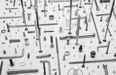 Screws and washers on white background