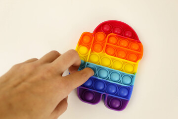 Anti-stress game. pop it. The child is bursting with anti-stress. Cheerful childhood. Simple...