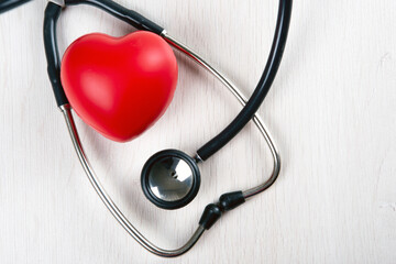 stethoscope on the table and red heart