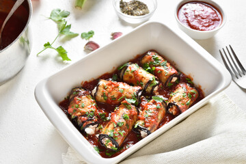Baked eggplant rolls with tomato sauce and cheese