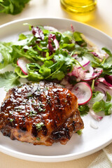 Roasted pork steak with salad from fresh vegetable