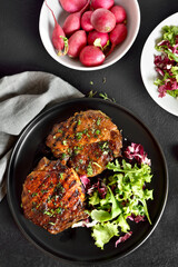 Roasted pork steak with vegetable salad