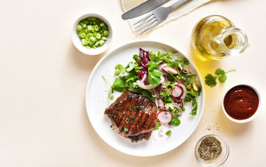 Roasted pork steak with salad from fresh vegetable