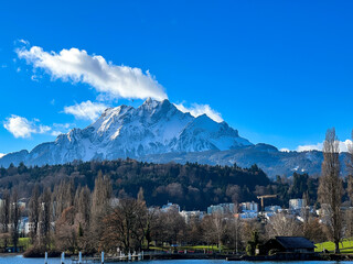 Naklejka premium Mount Pilatus with Clouds from Lake Lucerne Switzerland