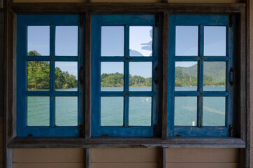 Old blue windows and beautiful seascape view