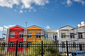 The progress of construction of the kindergarten building. Modern decoration of building facades