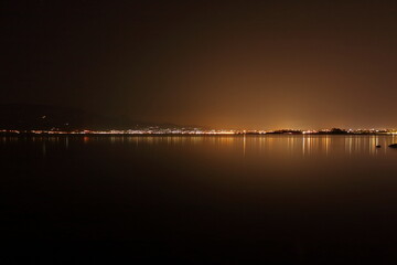 nighttime cityscape over the sea