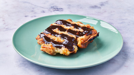  Plate of delicious waffle with chocolate on marble surface