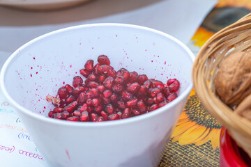 peeled pomegranate in plastic container