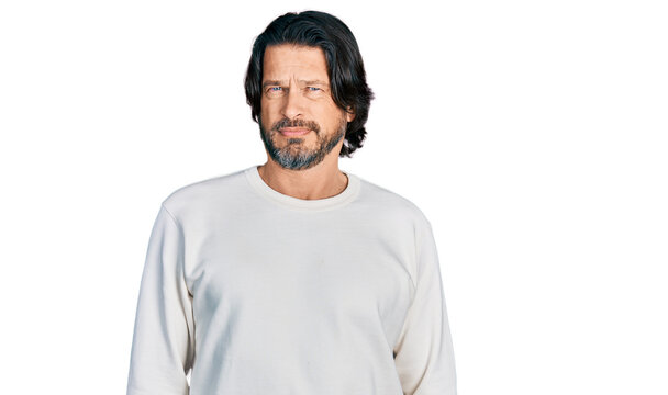 Middle age caucasian man wearing casual clothes skeptic and nervous, frowning upset because of problem. negative person.