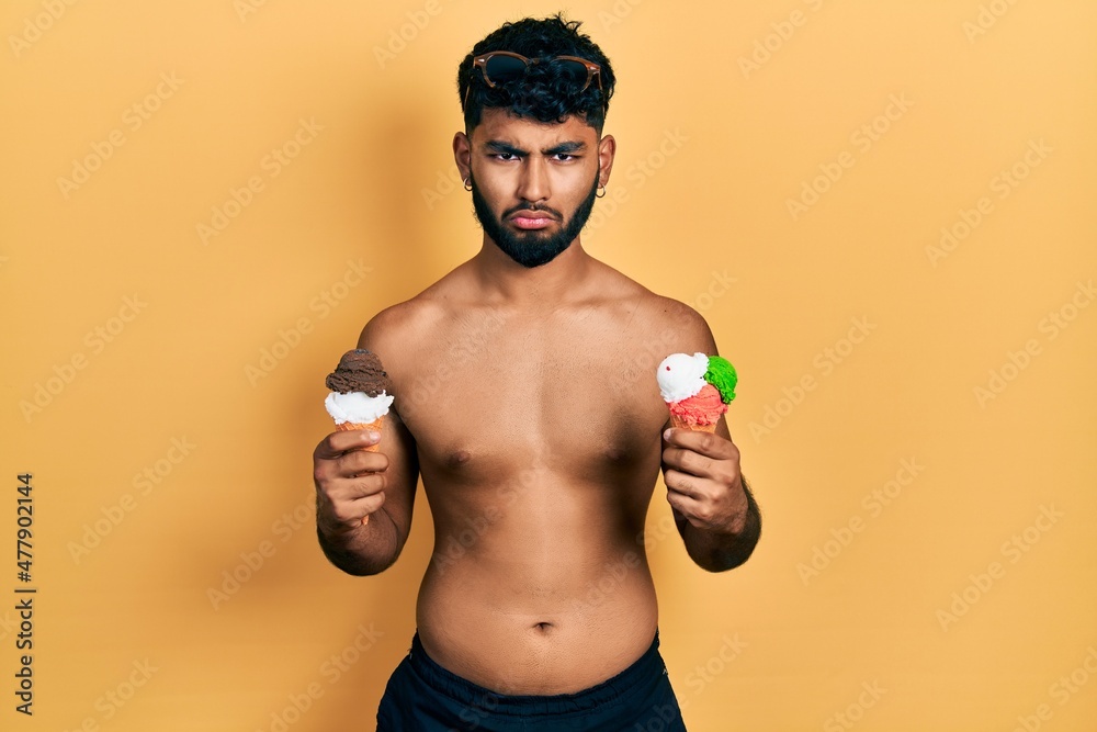 Sticker arab man with beard wearing swimwear eating two ice cream cones depressed and worry for distress, cr