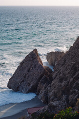 Sunset. Wild rock beach. The natural rock formation.