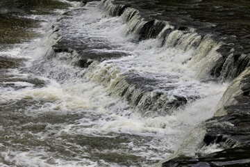 Falling water creates a flowing rapids 