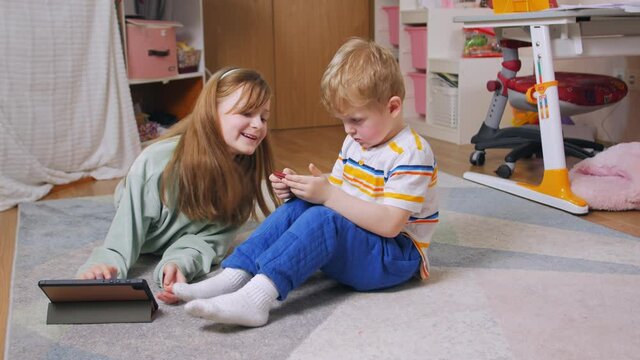 Childhood phone addiction boy and girl with gadgets