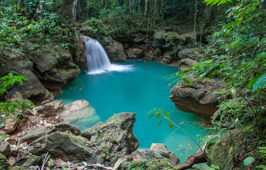 Beautiful waterfall with aqua blue water in the Jamaican jungle