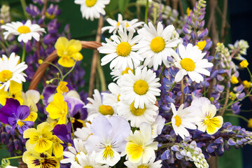 Summer flowers background close up. Beautiful bouquet by florist with daisy, chamomile, lupin and pansy flowers