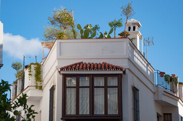 A typical street in old city Estepona with colorful flower pots. Estepona, Andalusia, Spain