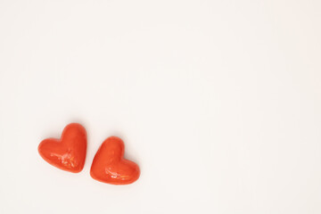 Red hearts on white background. Love or Valentine's day concept. Minimal, flat lay.