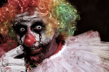 Portrait of terrifying clown, closeup. Halloween party costume