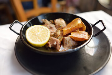Kleftiko from mutton by Cyprus. Kleftiko is a dish national cuisine of Cyprus. Stewed lamb meat served with potatoes and lemon.