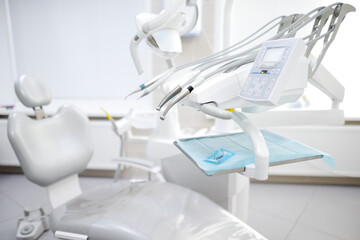 Professional dentist equipment and tools in the medical center. Dental clinic doctor appointment. Focus on dental drill.