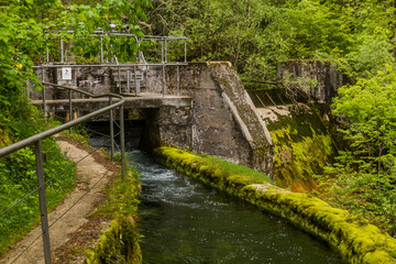 Fototapeta na wymiar Weir at Gljun stream near Bovec village, Slovenia