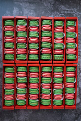 Green and red Macaron in red boxes
