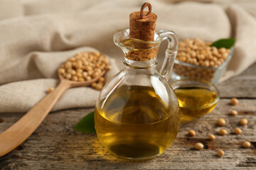 Composition with soybean oil on wooden table