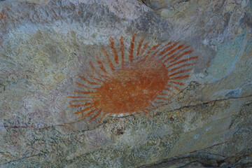 The rocky granite overhang with ancient rock painting.