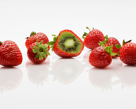 A composite image of strawberries with kiwi inside