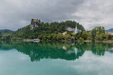 Fototapeta na wymiar Bled castle reflecting in Bled lake, Slovenia