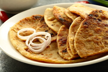 North Indian wholesome meal- traditional aloo paratha with fresh raita and potato curry.
