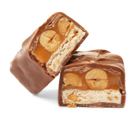 Cut chocolate bar with caramel, nuts and nougat isolated on white