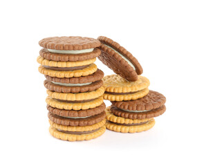 Different tasty sandwich cookies with cream on white background