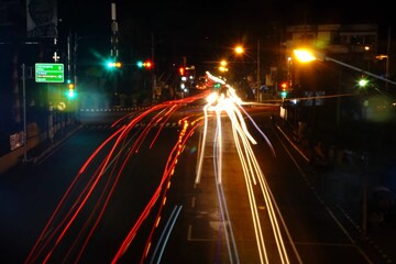 photo of light trail or photo of vehicle lights crossing Dhoho Kediri road at night.